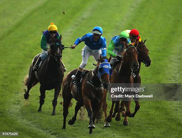 Jockey Luke Nolen riding Wanted wins the Group One Newmarket Handicap on Super Saturday at Flemington Racecourse on March 6, 2010 in Melbourne,...