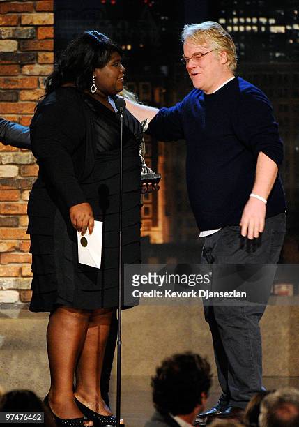 Actress Gabourey Sidibe accepts Best Female Lead for "Precious" from presenter Philip Seymour Hoffman onstage during the 25th Film Independent's...
