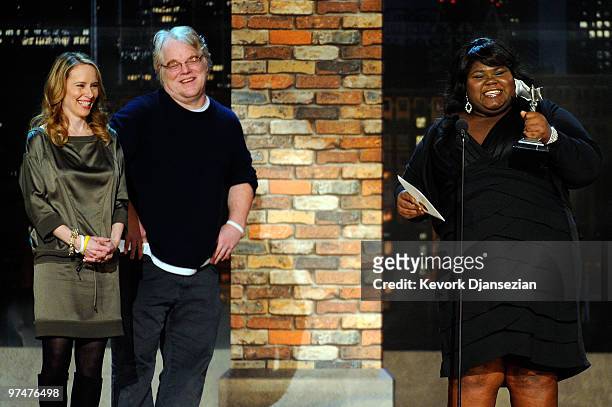 Actress Gabourey Sidibe accepts Best Female Lead for "Precious" from presenters Amy Ryan and Philip Seymour Hoffman onstage during the 25th Film...