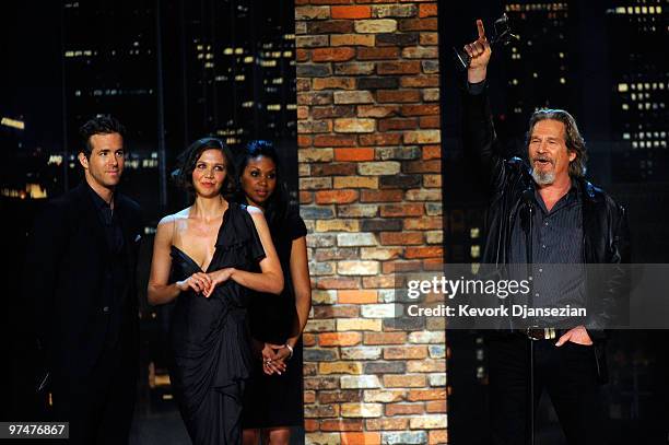 Actor Jeff Bridges accepts Best Male Lead award for "Crazy Heart" with presenters Ryan Reynolds and Maggie Gyllenhaal onstage during the 25th Film...