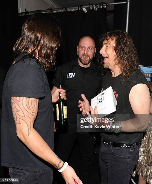 Musician Dave Grohl with musicians Glenn Five, Steve 'Lips' Kudlow of the band Anvil backstage at the 25th Film Independent's Spirit Awards held at...