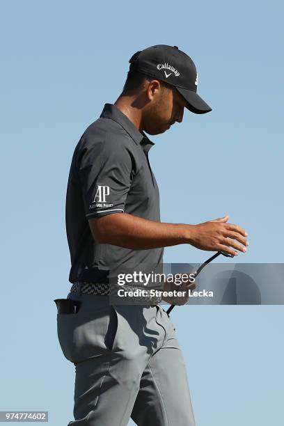 Xander Schauffele of the United States walks on the first green during the first round of the 2018 U.S. Open at Shinnecock Hills Golf Club on June...