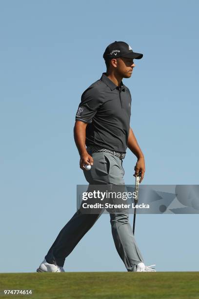 Xander Schauffele of the United States walks on the first green during the first round of the 2018 U.S. Open at Shinnecock Hills Golf Club on June...