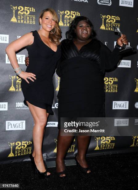 Singer-actress Mariah Carey and actress Gabourey Sidibe, winner Best Female Lead for 'Precious,' pose in the press room at the 25th Film...