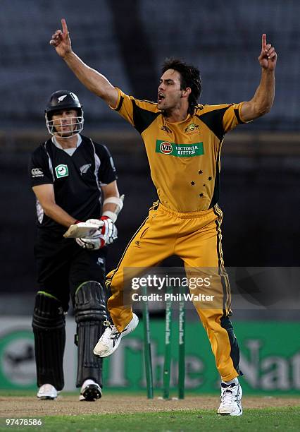 Mitchell Johnson of Australia celebrates bowling Shane Bond of New Zealand during the Second One Day International match between New Zealand and...