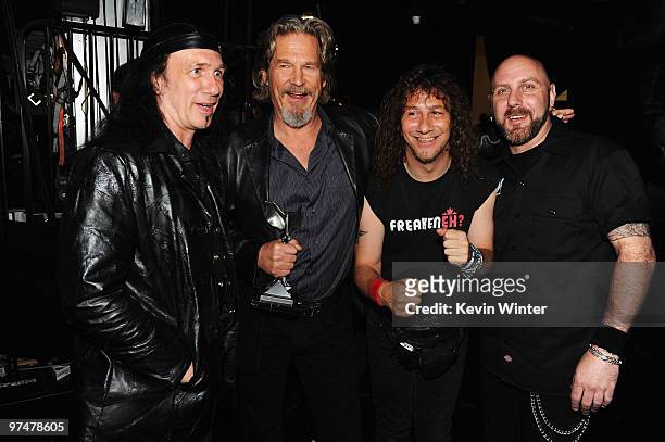 Actor Jeff Bridges poses with musicians Robb Reiner, Steve 'Lips' Kudlow and Glenn Five of Anvil backstage at the 25th Film Independent's Spirit...
