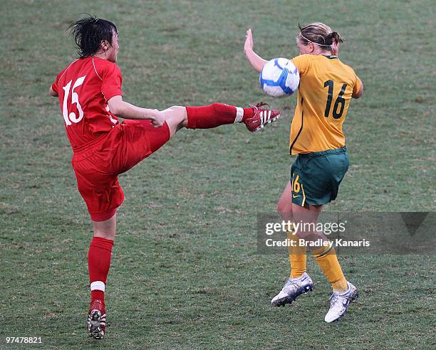 Elise Kellond-Knight of Australia and Myong Hwa Jon of Korea challenge for the ball during the international friendly between Australia and DPR Korea...
