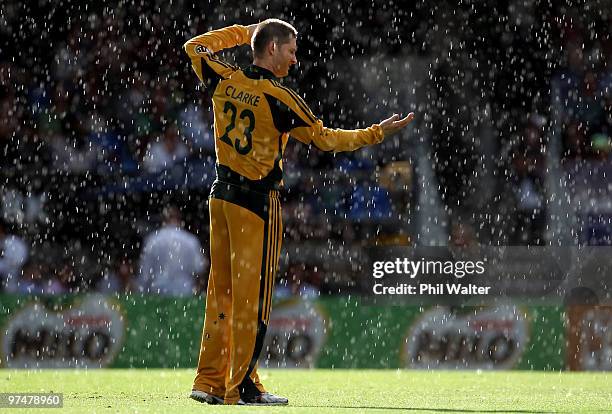 Michael Clarke of Australia holds out his hand into the rain during the Second One Day International match between New Zealand and Australia at Eden...