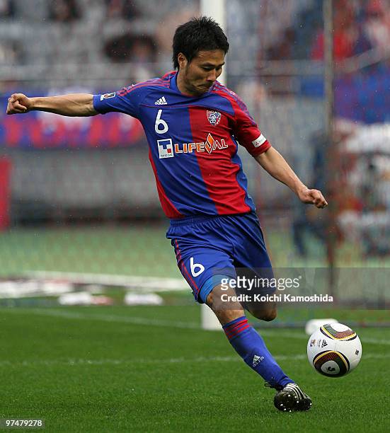 Yasuyuki Konno of FC Tokyo kicks during the J.League match between FC Tokyo and Yokohama F. Marinos at Ajinomoto Stadium on March 6, 2010 in Tokyo,...