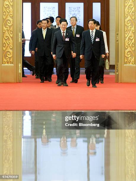 Zhang Ping, director of the Chinese National Development and Reform Commission , right, Zhou Xiaochuan, governor of the People's Bank of China, left...