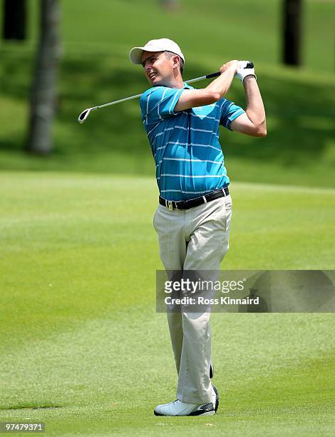 Peter Lawrie of Ireland plays his second shot on the sixth hole during the third round of the Maybank Malaysia Open at the Kuala Lumpur Golf &...