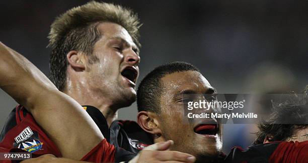 Robbie Fruean of the Crusaders celebrates his try with team mate Richie McCaw during the round four Super 14 match between the Crusaders and the...