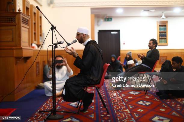 An Iman prays for Grenfell victims at Al Manaar Mosque on the one year anniversary of the Grenfell Tower fire on June 14, 2018 in London, England....