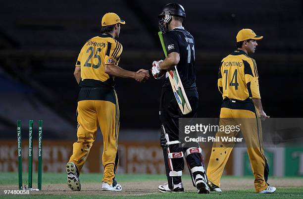 Daniel Vettori of New Zealand shakes hands with Mitchell Johnson of Australia at the end of the Second One Day International match between New...