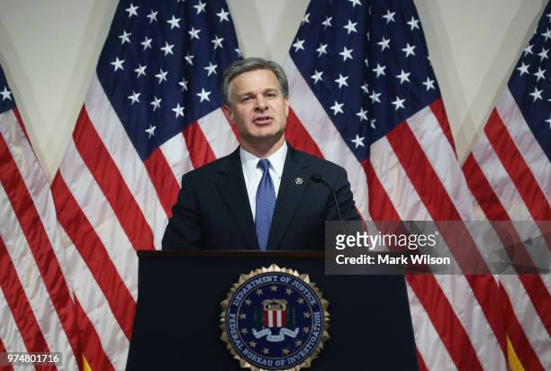 Director is Christopher A. Wray speaks to the media during a news conference at FBI Headquarters, on June 14, 2018 in Washington, DC. Earlier today...