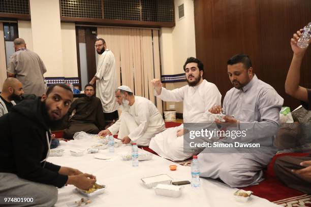 Worshippers break their fast as Ramadan ends and celebrate Eid al-Fitr after saying prayers for the victims of the Grenfell Tower Fire on the one...