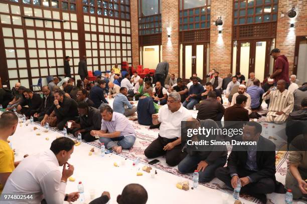 Worshippers break their fast as Ramadan ends and celebrate Eid al-Fitr after earlier saying prayers for the victims of the Grenfell Tower fire on the...