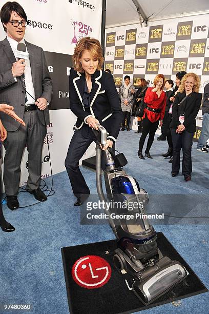 Mark Olsen and actress Jodie Foster with the LG Electronics Kompressor Vacuum on The 25th Spirit Awards Blue Carpet held at Nokia Theatre L.A. Live...