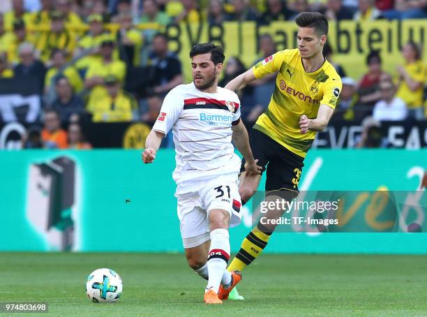 Kevin Volland of Leverkusen and Julian Weigl of Dortmund battle for the ball during the Bundesliga match between Borussia Dortmund and Bayer 04...