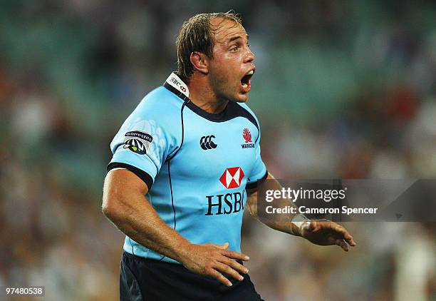 Waratahs captain Phil Waugh talks to his team during the round four Super 14 match between the Waratahs and the Sharks at the Sydney Football Stadium...