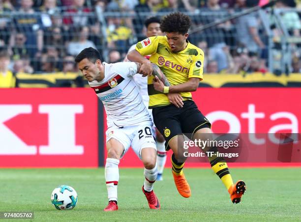 Charles Aranguiz of Leverkusen and Jadon Malik Sancho of Dortmund battle for the ball during the Bundesliga match between Borussia Dortmund and Bayer...