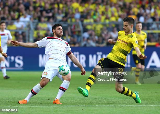 Kevin Volland of Leverkusen and Julian Weigl of Dortmund battle for the ball during the Bundesliga match between Borussia Dortmund and Bayer 04...