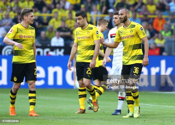 Lukasz Piszczek of Dortmund, Sokratis Papastathopoulos of Dortmund and Oemer Toprak of Dortmund look on during the Bundesliga match between Borussia...