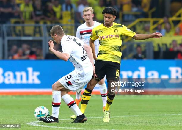 Sven Bender of Leverkusen and Mahmoud Dahoud of Dortmund battle for the ball during the Bundesliga match between Borussia Dortmund and Bayer 04...