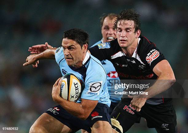 Daniel Halangahu of the Waratahs makes a break during the round four Super 14 match between the Waratahs and the Blues at Sydney Football Stadium on...