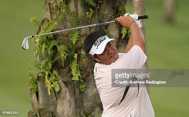 Kiradech Aphibarnrat of Thailand hits his second shot on the 18th hole during the the third round of the Maybank Malaysian Open at the Kuala Lumpur...