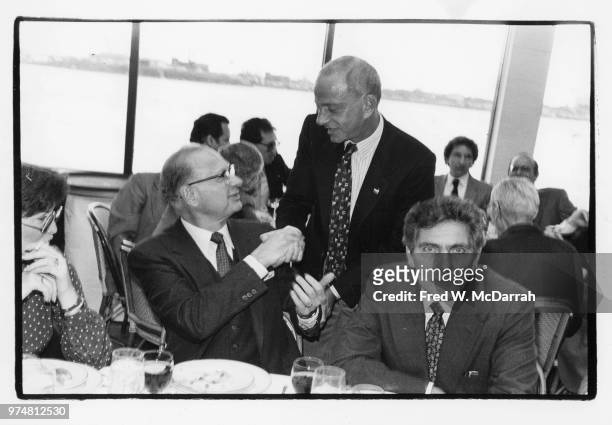American politician and leader of the Kings County Democratic Party Meade Esposito shakes hands with attorney Roy Cohn during a Citymeals-on-Wheels...