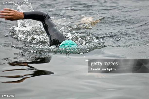 triathlete warms up - standing water stock pictures, royalty-free photos & images
