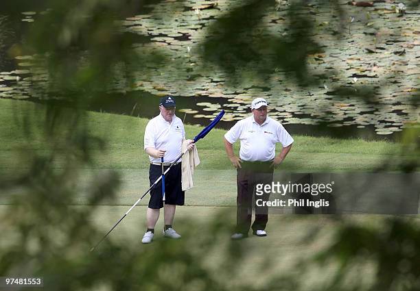 Ian Woosnam of Wales with his caddie, former world snooker champion, Denis Taylor in action during the second round of the Aberdeen Brunei Senior...