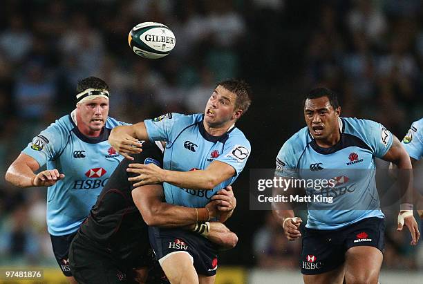 Drew Mitchell of the Waratahs loses the ball in a tackle during the round four Super 14 match between the Waratahs and the Blues at Sydney Football...