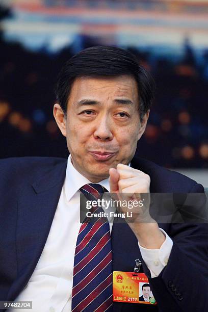 Chongqing Municipality Communist Party Secretary Bo Xilai attends a meeting during the annual National People's Congress at the Great Hall of the...