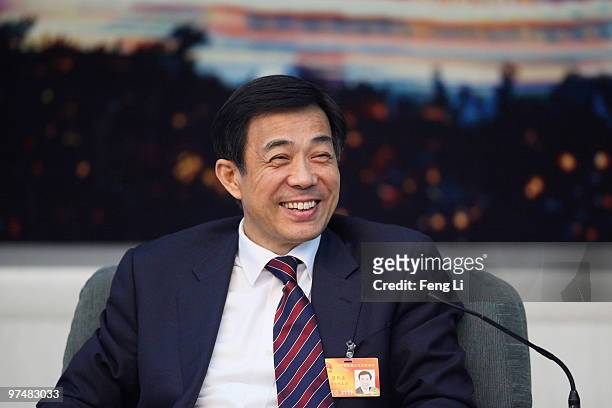 Chongqing Municipality Communist Party Secretary Bo Xilai attends a meeting during the annual National People's Congress at the Great Hall of the...