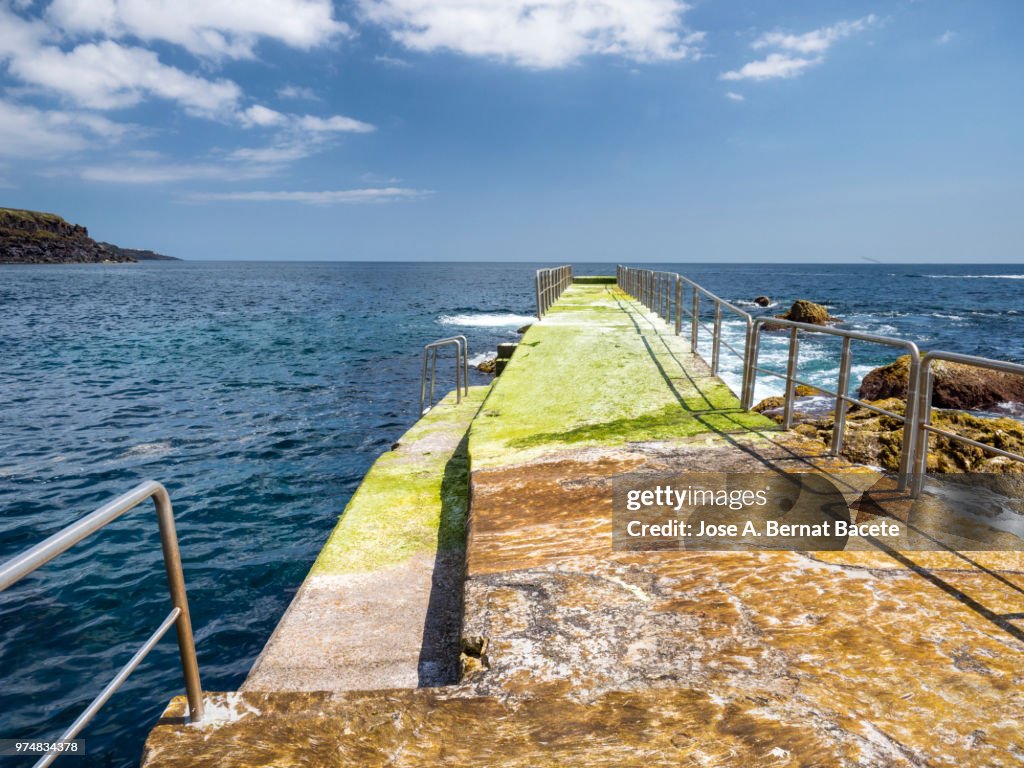 Natural pools within rocky lava coast near Atlantic Ocean, Cinco Ribeiras, Terceira Island, Azores Islands, Portugal