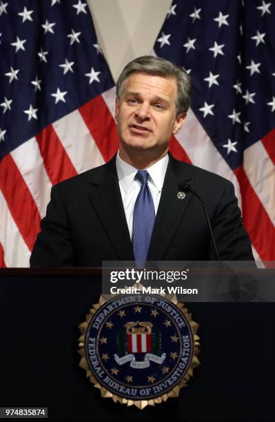 Director is Christopher A. Wray speaks to the media during a news conference at FBI Headquarters, on June 14, 2018 in Washington, DC. Earlier today...