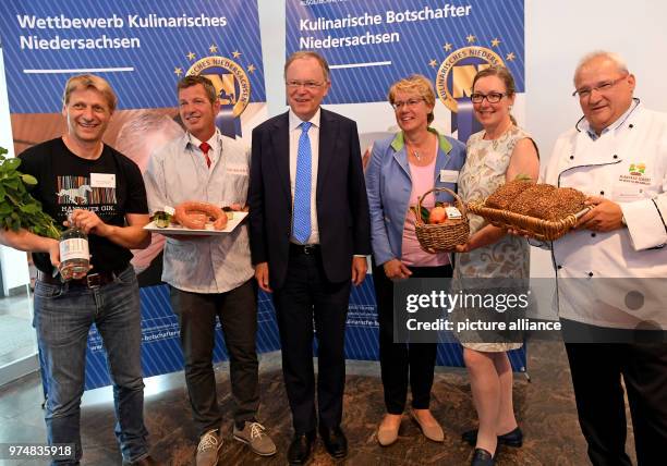 June 2018, Germany, Hanover: Prize-winners Joerma Biernath, Hannover Gin Gmbh; master butcher Jens Neubauer with Braunschweiger Mettwurst; Stephan...