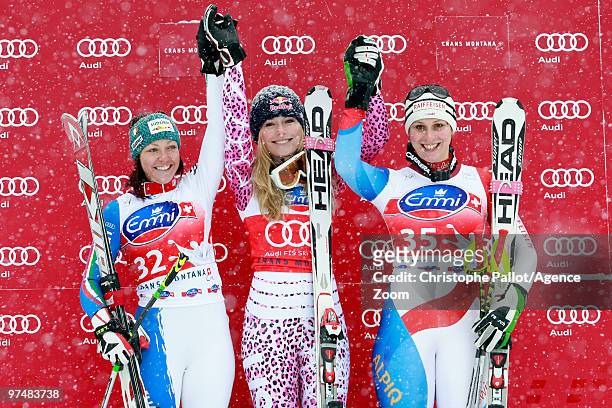 Lindsey Vonn of the USA takes 1st place, Johanna Schnarf of Italy takes 2nd place, Marianne Abderhalden of Switzerland takes 3rd place during the...
