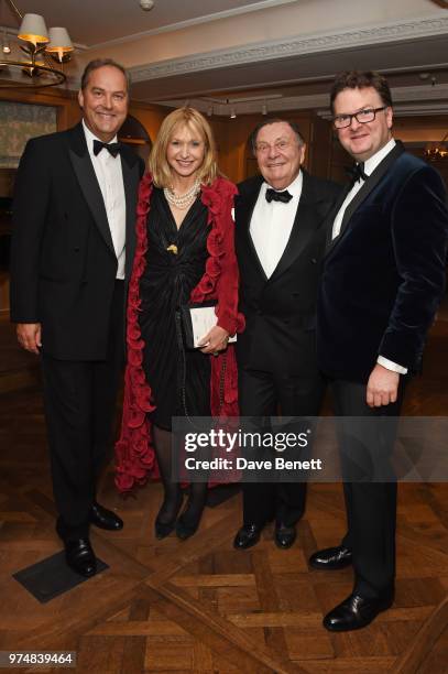 Harry Herbert, Lizzie Spender, Barry Humphries and Ewan Venters attend the Highclere Thoroughbred Racing Royal Ascot dinner at Fortnum & Mason on...