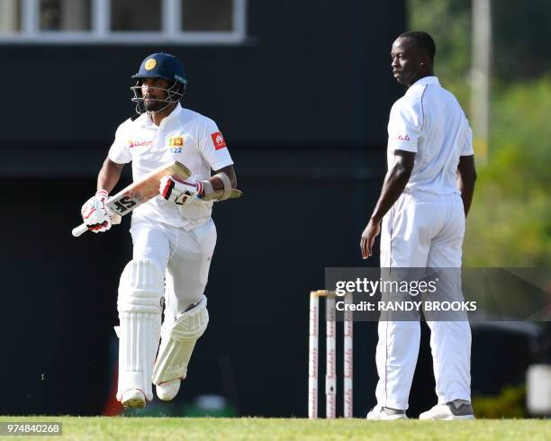Dinesh Chandimal of Sri Lanka get runs off Kemar Roach of West Indies during day 1 of the 2nd Test between West Indies and Sri Lanka at Daren Sammy...