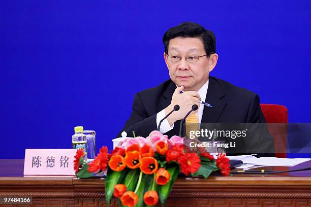 China's Commerce Minister Chen Deming attends a news conference during China's annual session of parliament at The Great Hall Of The People on March...