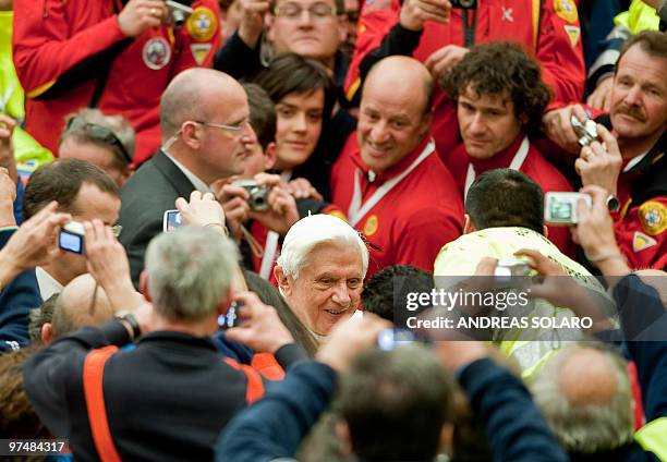 Pope Benedict XVI smiles to Italian Civil Protection volunteers as he arrives for the Audience to Italian organization in Aula Paolo VI at the...