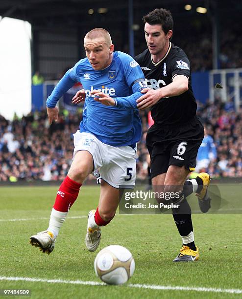 Jamie O'Hara of Portsmouth competes against Liam Ridgewell of Birmingham City during the FA Cup sponsored by E.ON 6th Round match between Portsmouth...