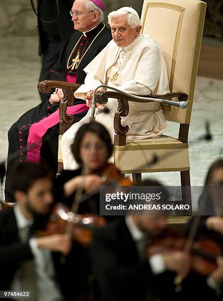 Pope Benedict XVI looks to musicians during the Audience with a Head of the Italian Civil Protection Guido Bertolaso and volunteers of the Italian...