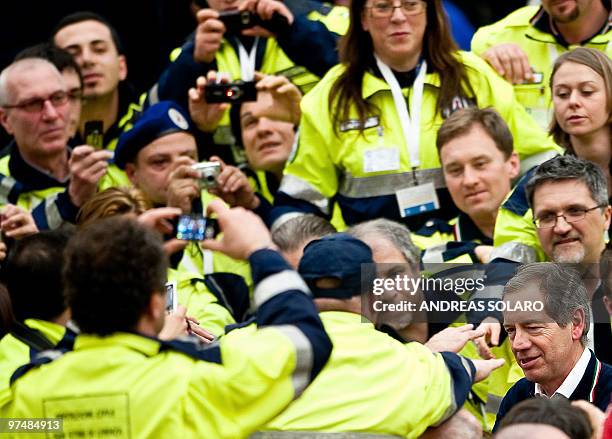 The head of the Italian Civil Protection Guido Bertolaso is cheered by his volunteers as he leaves Aula Paolo VI, at the end of the Audience of Pope...