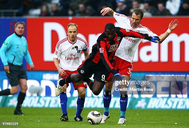 David Rozehnal of Hamburg and Adrian Ramos of Berlin compete for the ball during the Bundesliga match between Hamburger SV and Hertha BSC Berlin at...