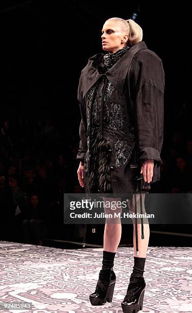 Model walks the runway during the Viktor & Rolf Ready to Wear Show as part of the Paris womens wear Fashion Week Fall Winter 2011 at Espace Ephemere...