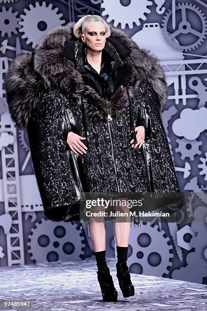 Model Kristen McMenamy walks the runway during the Viktor & Rolf Ready to Wear Show as part of the Paris womens wear Fashion Week Fall Winter 2011 at...